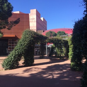 A building with a red roof and a sign that reads "Archipel."
