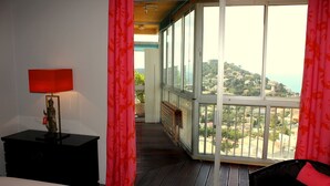 A balcony with a view of a hillside. -  Apartment with Exceptional Panorama (Villefranche sur Mer)
