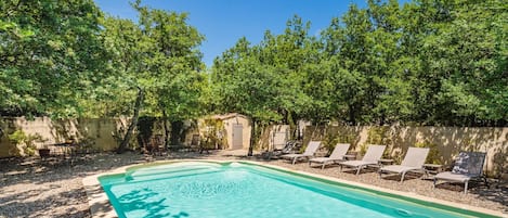 Outdoor pool, a heated pool, pool loungers