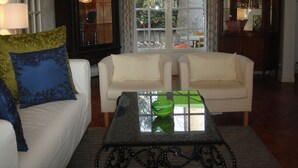 A living room with two white sofas, a glass coffee table, and a patterned throw pillow. - Townhouse ,, 3 + 1 bedrooms, 2. 5 bathrooms, air conditioning, wifi PRICE REDUCED (Fréjus)