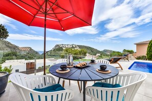 Outdoor dining - Modern 3-bed Villa with Heated Private Pool, Hot Tub, Sea views, & Garden (Moraira)