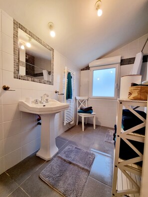 Shower, hair dryer, towels, soap