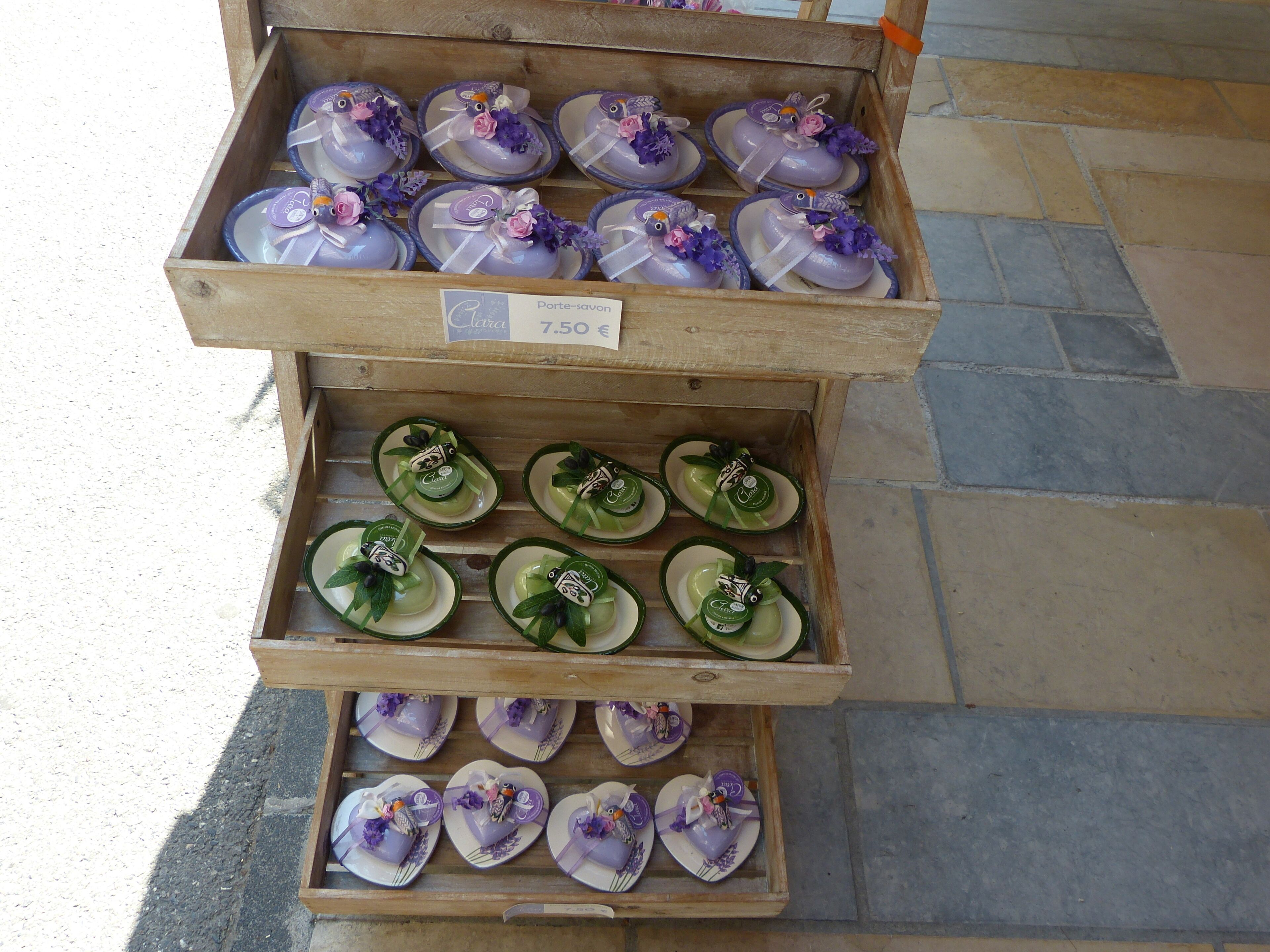 A display of ceramic plates with floral designs, priced at 7.50 euros.