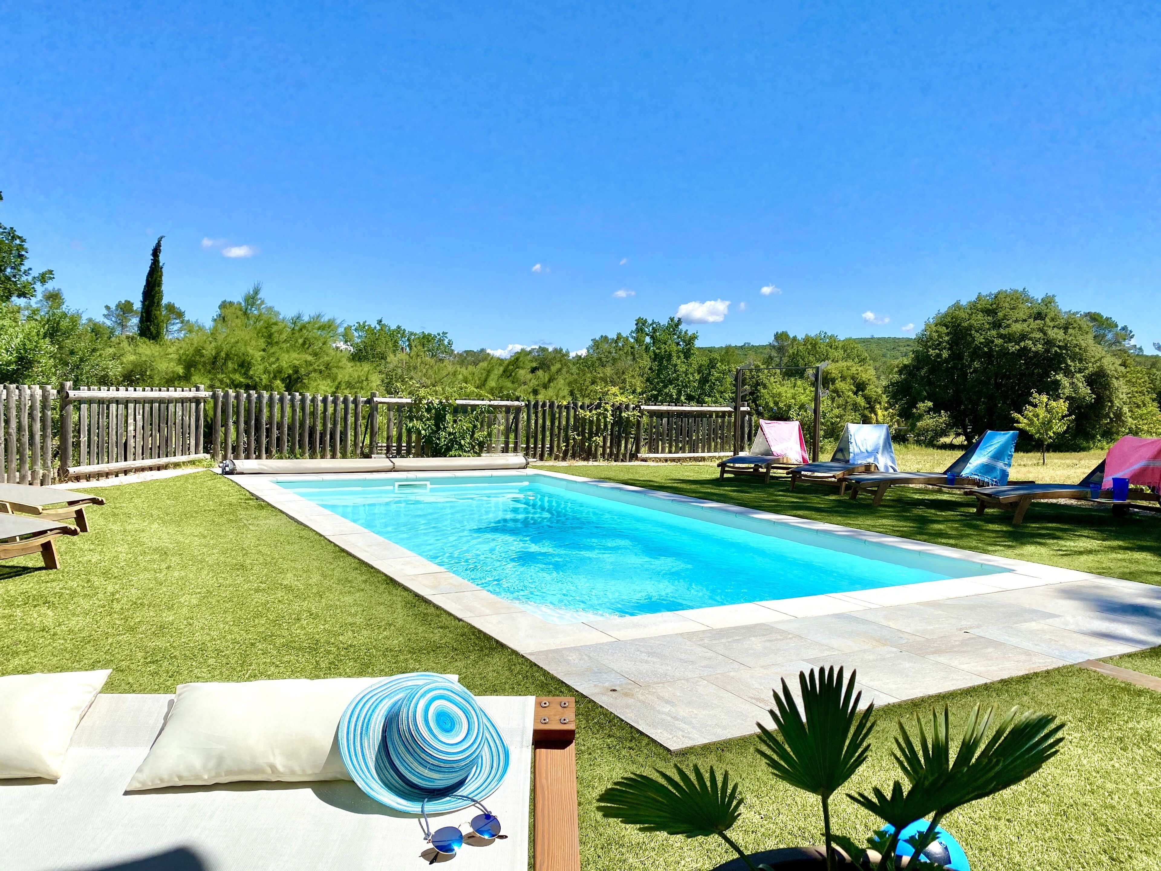 Outdoor pool, a heated pool, pool loungers