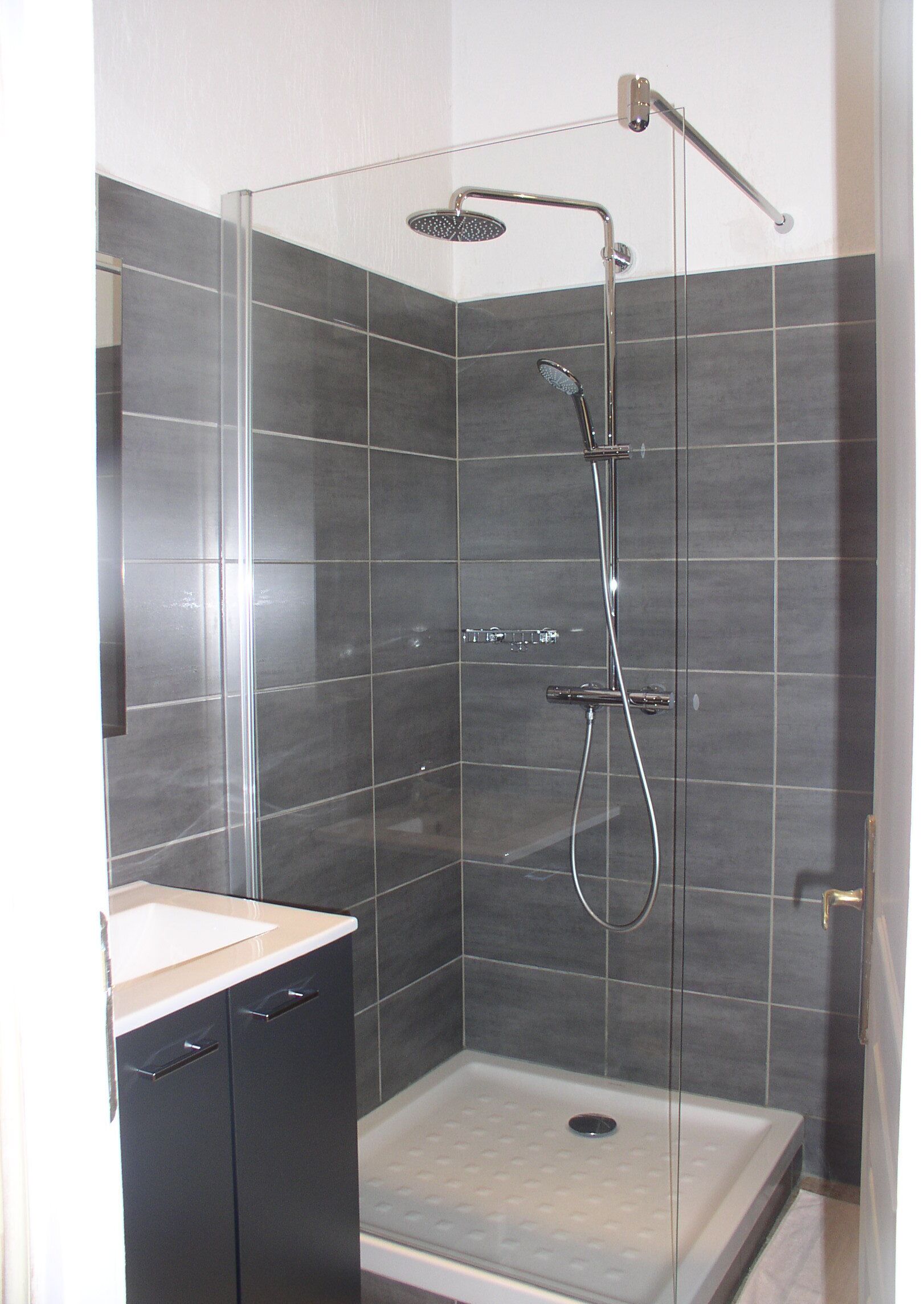 Combined shower/tub, hair dryer, towels, toilet paper