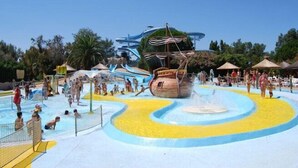 A water park with a large ship-themed play area, multiple slides, and a sandy play zone. - Studio Seaside - Saint Cyr sur Mer (Les Lecques) (Saint-Cyr-sur-Mer)