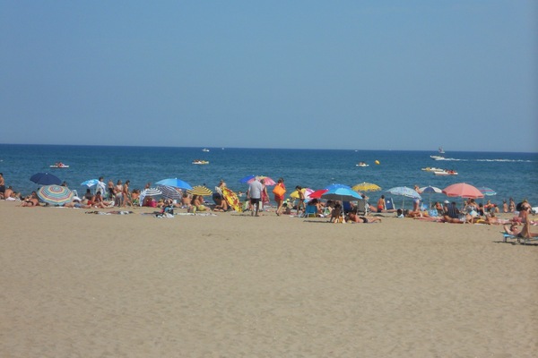 On the beach, sun-loungers, beach towels