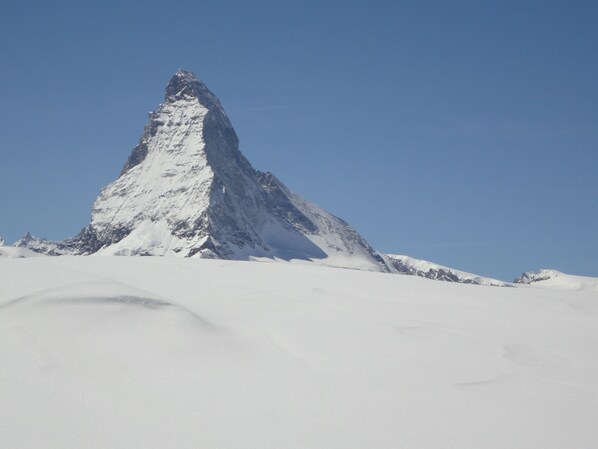A snow-covered mountain peak under a clear sky. - Zermatt centre - High standing all mod cons rental - View of the Cervin (Zermatt)