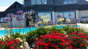 A heated pool, pool loungers