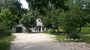 A white building with a gravel driveway leading to a gated entrance. - HOUSE IN THE HEART OF THE VALLEYS CEVENOLES large pool access (Chambon)