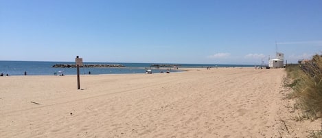 On the beach, sun-loungers