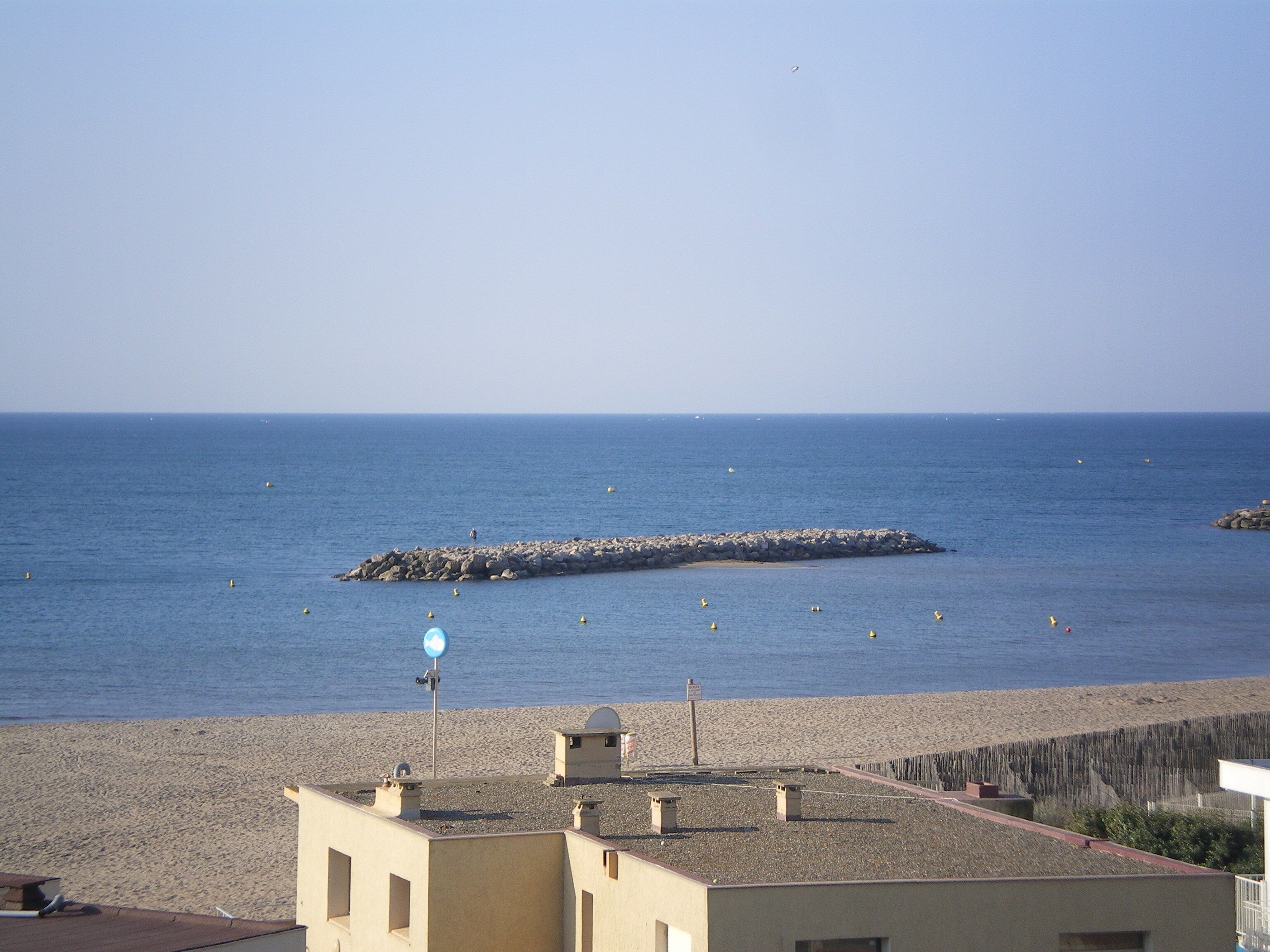On the beach, sun-loungers