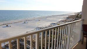 A beach view from a balcony with a railing, sandy beach, and ocean. - Perfect Family or Romantic Getaway~Best View in Orange Beach~Summer specials (Orange Beach)