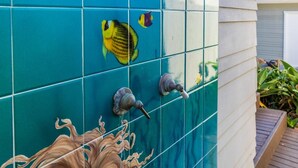 A wall with blue tiles, a water feature, and a small garden area. - “Blue Door Cottage by the Sea,” La Jolla Village & Cove, Only 4 blocks to Beach  (La Jolla)