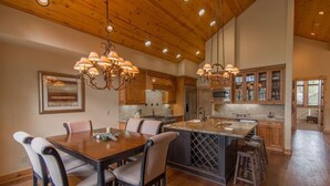 A spacious kitchen with a large island, wooden cabinets, and pendant lighting. - "Lovely Lookout" Ski, Golf & Club Amenities Schaffer's Mill, Lake Tahoe (Truckee)