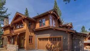 A large, two-story wooden house with a stone chimney, a garage, and a stone foundation. - "Lovely Lookout" Ski, Golf & Club Amenities Schaffer's Mill, Lake Tahoe (Truckee)