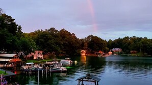 A lakeside dock with boats, a gazebo, and houses in the background. - Spring special! Enjoy Lake Martin at its best! (Jacksons Gap)