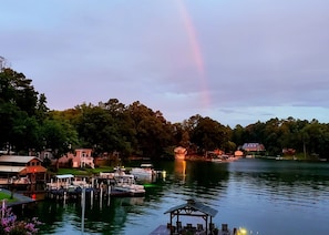 A lakeside dock with boats, a gazebo, and houses in the background. - Spring special! Enjoy Lake Martin at its best! (Jacksons Gap)