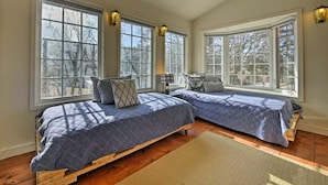 A bedroom with two beds, large windows, and a wooden floor. - Steps to Bear Mountain & Golf Course Spacious 4BR Prime Moonridge Location (Big Bear Lake)