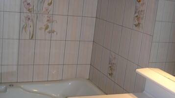 Bathtub, hair dryer, bidet, towels