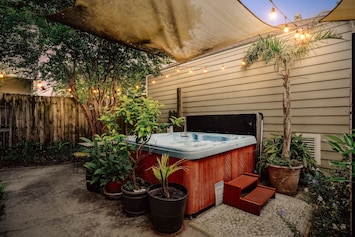 Under the stars, amidst lush tropical greenery, indulge in relaxation. Our 8-person hot tub awaits in the enchanting ambiance of our courtyard garden.
