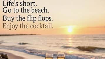 On the beach, sun loungers, beach towels