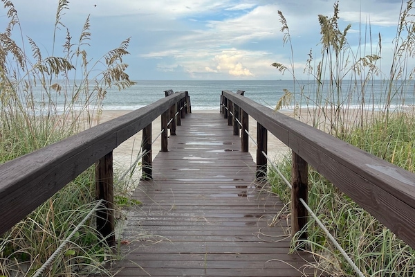 Leave your worries behind! A private boardwalk leads you straight to the sand!
