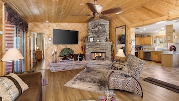 Smart TV, fireplace, books, stereo