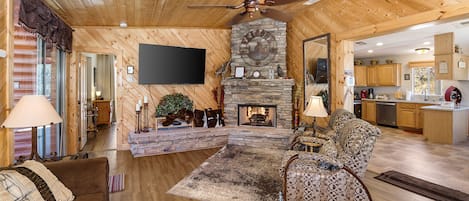 Smart TV, fireplace, books, stereo