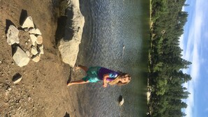 A person standing by a calm body of water with rocks and trees in the background. - Quaint Cabin With Spectacular Views Of The Granite Dells, Great Hiking/Kayaking! (Prescott)