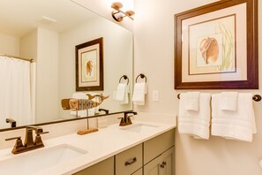 Combined shower/bathtub, hair dryer, towels, toilet paper