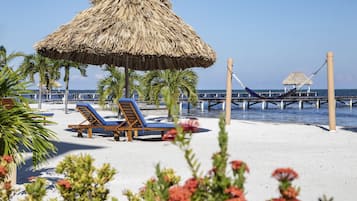 On the beach, sun loungers, beach towels