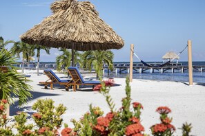 On the beach, sun loungers, beach towels