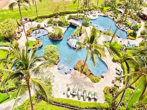 A resort with a large central pool surrounded by palm trees and lounge chairs. - LAST MINUTE DEAL! TOP RATED 3Bed/3Bath Ko Olina Beach Villa~Amazing Ocean Views! (Kapolei)