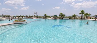 Rates just lowered.  Enjoy The WHITE BEACHES, LAZY RIVER, the CARIBE has it ALL