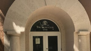The entrance to The Yacht Club Gym with a sign above the doors and a doormat at the entrance. - THE NAUTICAL!  FULLY EQUIPPED  3 BD 2BA APT AT AVENTURA  YACHT CLUB! (Aventura)