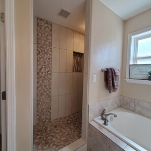 Combined shower/tub, hair dryer, towels, soap