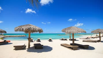 On the beach, sun-loungers, beach towels