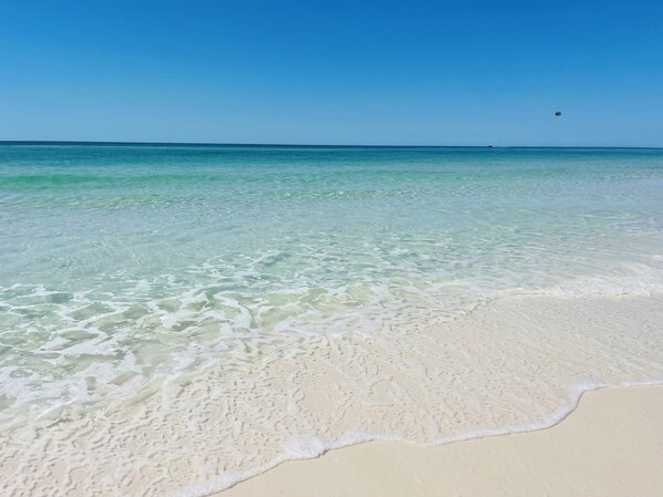 On the beach, sun-loungers, beach towels