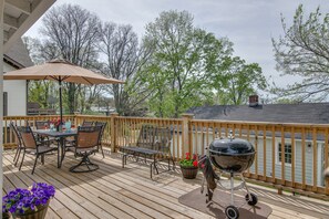 Enjoy al fresco dining on the deck with a barbecue grill and comfortable seating.