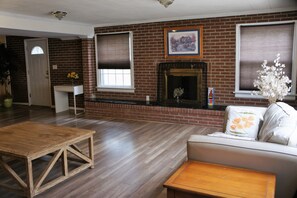 Smart TV, fireplace, books, video library
