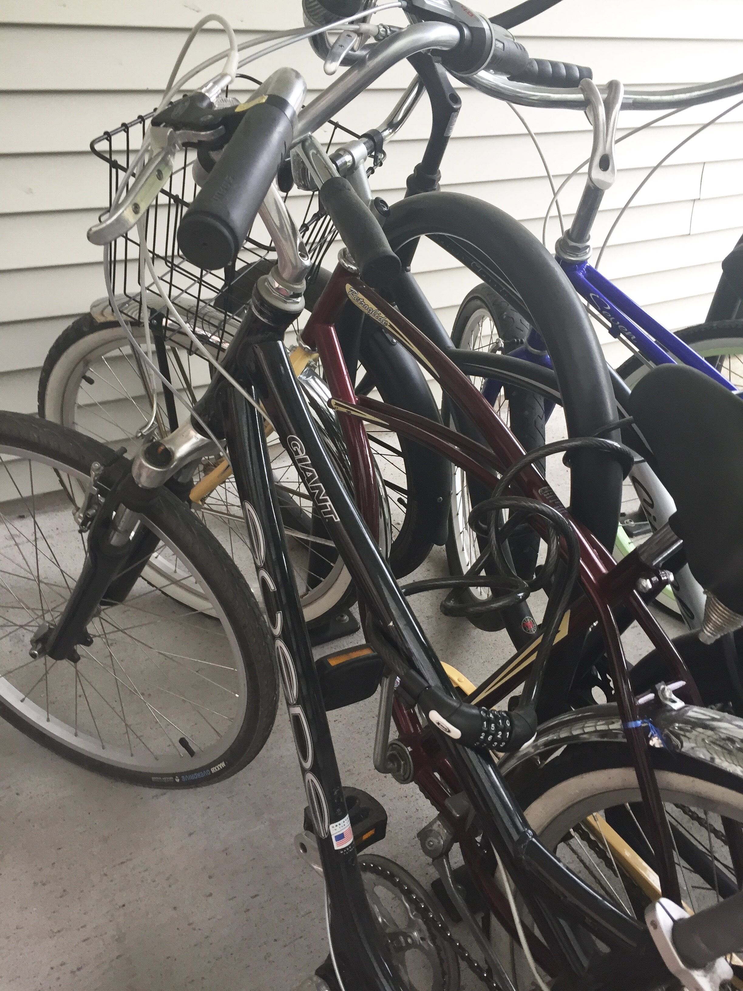 A bicycle rack with multiple bicycles parked.