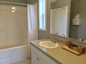 Combined shower/bathtub, hair dryer, towels, soap