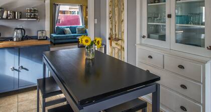 We have A/C! Relax in the hot tub! modern design, family and pet friendly!