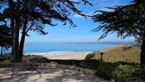 A coastal view with a paved walkway, trees, and a beach. - Seascape Resort 2B Luxury Oceanview Villa, Steps From The Beach, 5 min to golf (Aptos)