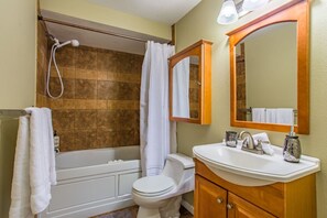 A bathroom with a bathtub, toilet, and sink. - the Veranda, Best Area, 2 Baths, WD, Jacuzzi bath (Tacoma)