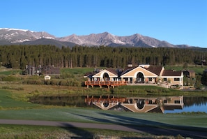 Enjoy serene views from the expansive porch area overlooking the tranquil lake.