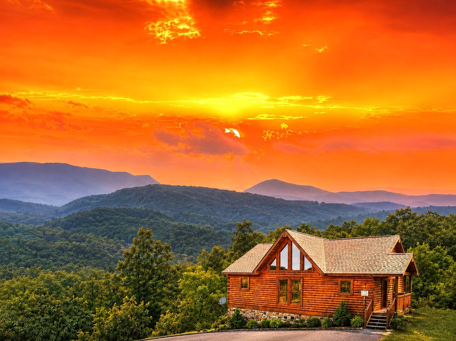 A wooden cabin with a stone foundation, surrounded by lush greenery and mountains in the background.