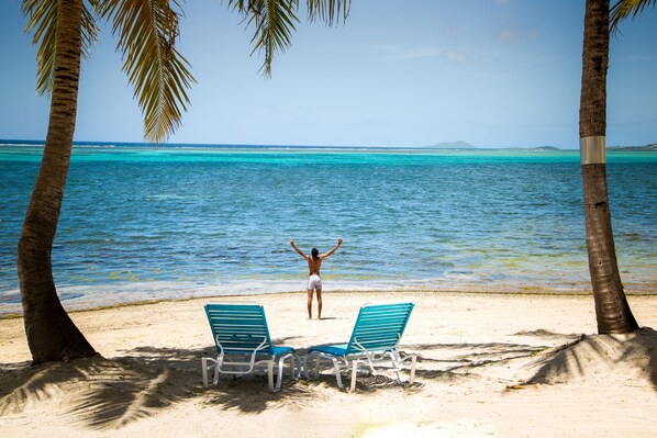 On the beach, sun-loungers, beach towels
