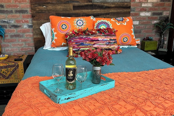 Relaxation for (2) in this charming sleeping area complete with phone chargers